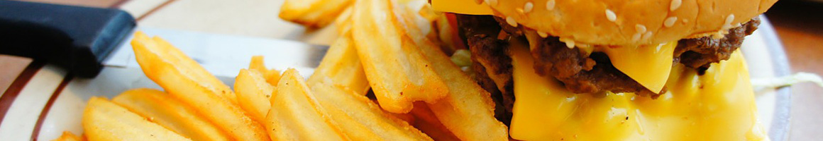 Eating American (Traditional) Burger at Tower Burger restaurant in San Francisco, CA.
